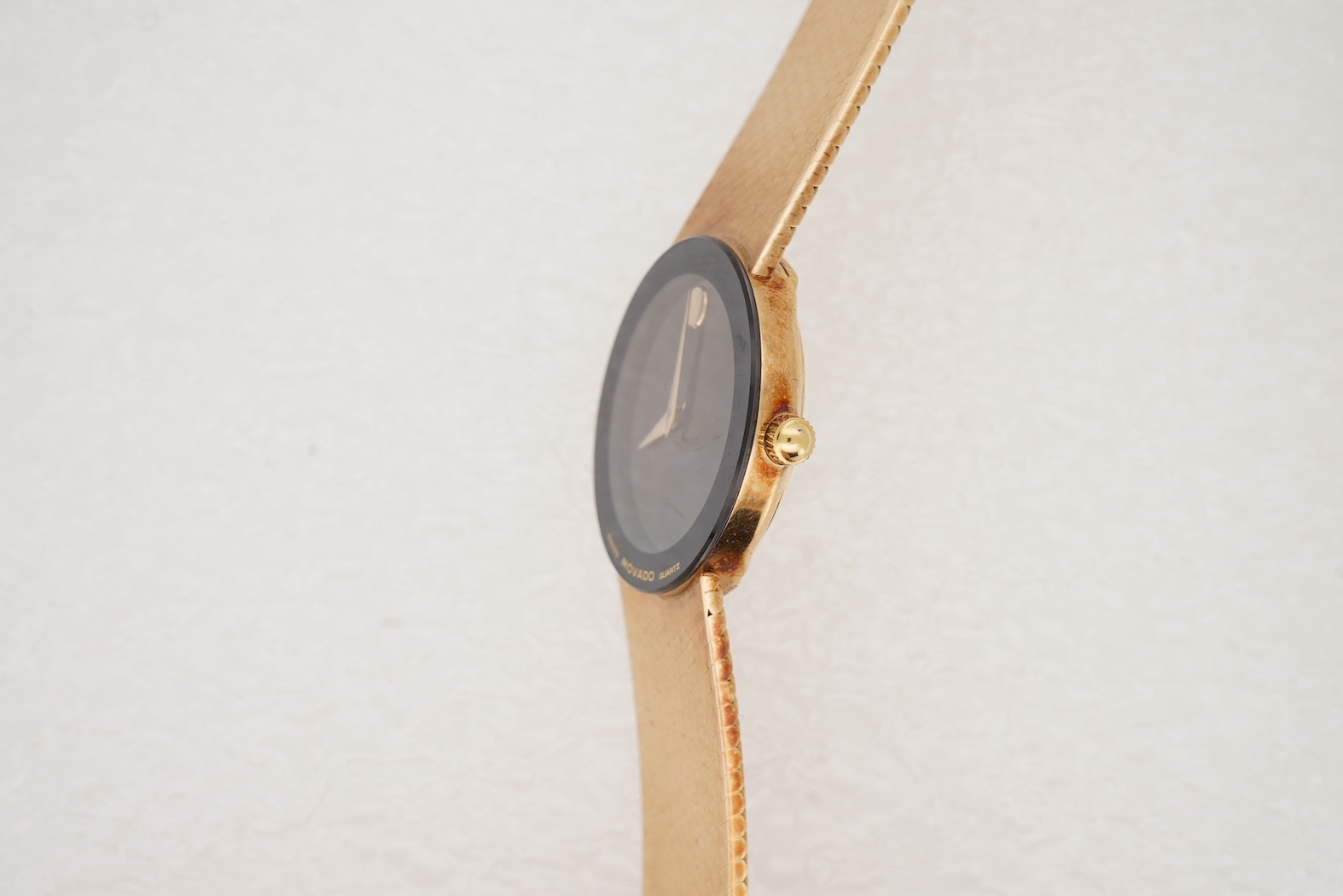 A lady's late 20th century Swiss Movado Museum 14k yellow metal quartz wrist watch, on an integral Italian 14k bracelet